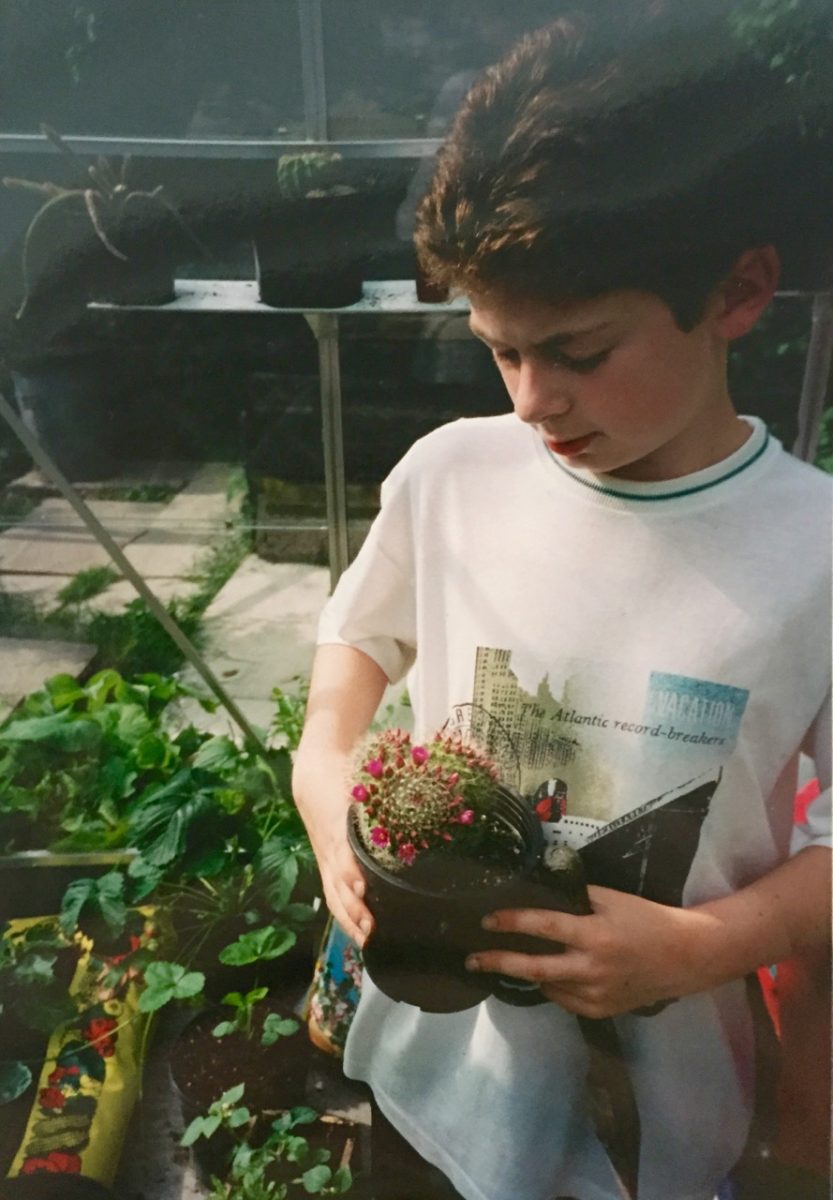 My parents recently found this photo of me as a boy in my greenhouse with some of my cacti collection