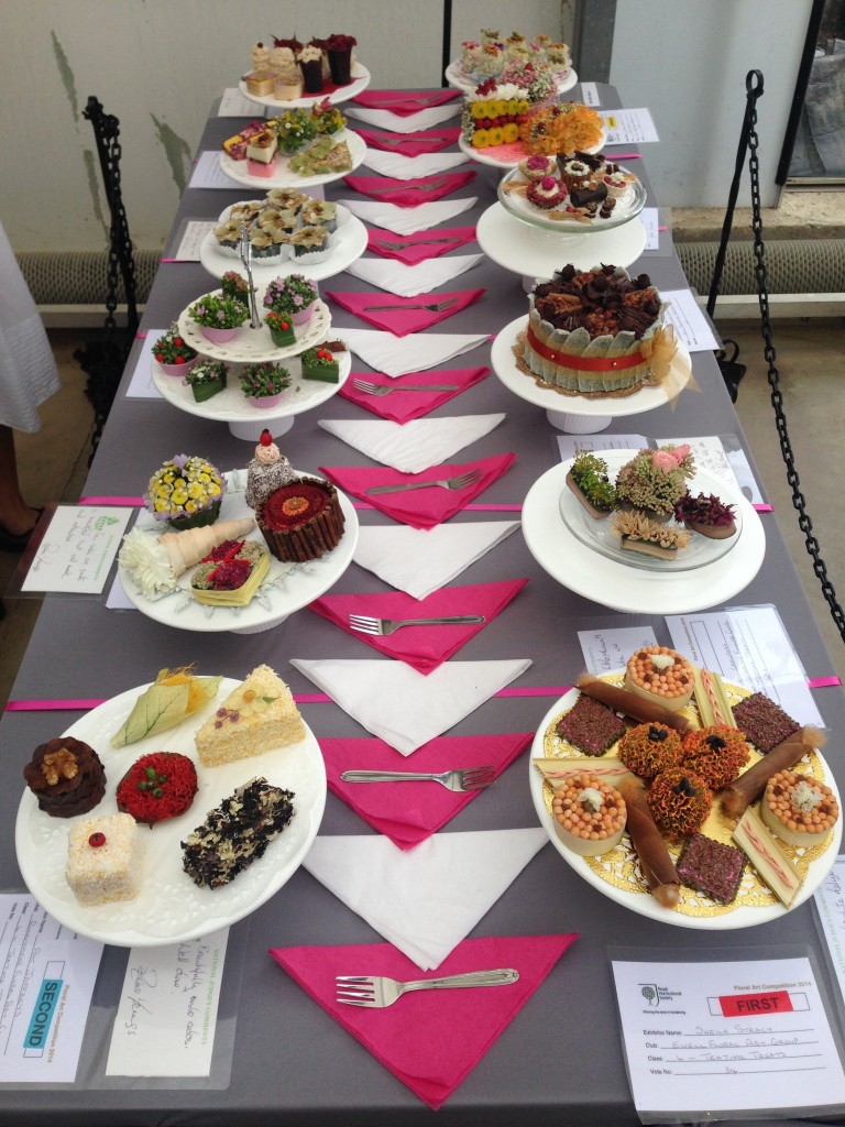 A table of cakes made entirely from flowers as part of the RHS Wisley Flower Show - don't eat them!